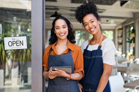 Business women opening up their shop